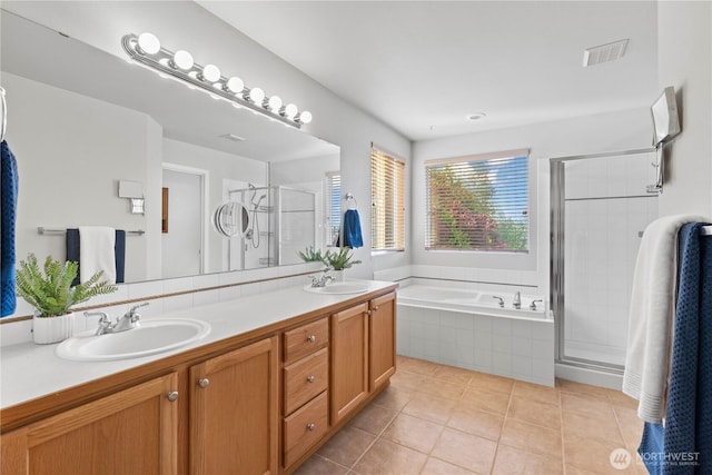 710 122nd Avenue Ct E, Edgewood, WA 98372 - bathroom with a sink, double vanity, a shower stall, visible vents, and a bath