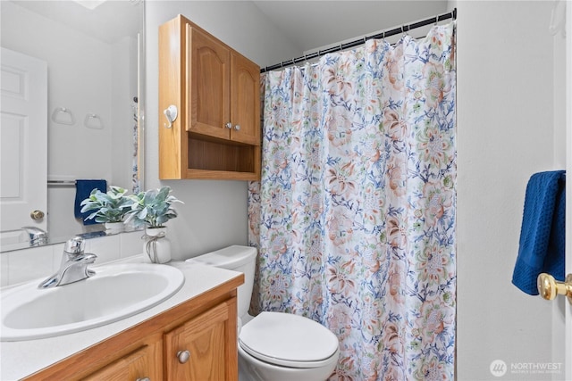 710 122nd Avenue Ct E, Edgewood, WA 98372 - bathroom featuring vanity, toilet, and a shower with curtain
