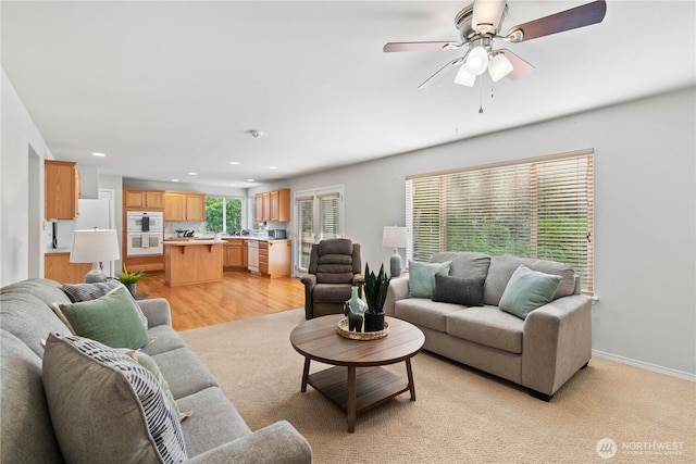 710 122nd Avenue Ct E, Edgewood, WA 98372 - living area featuring recessed lighting, baseboards, ceiling fan, and light wood-style floors