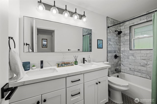 full bathroom featuring double vanity, a sink, shower / tub combo, and toilet