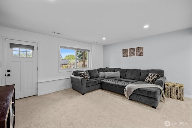 carpeted living area with baseboards, recessed lighting, and visible vents