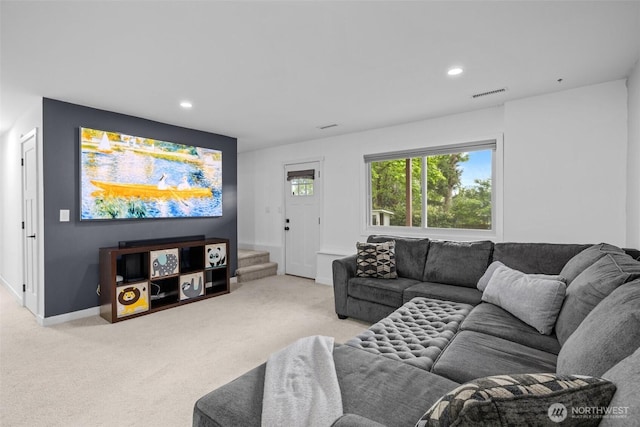 living room with carpet flooring, recessed lighting, baseboards, visible vents, and stairway