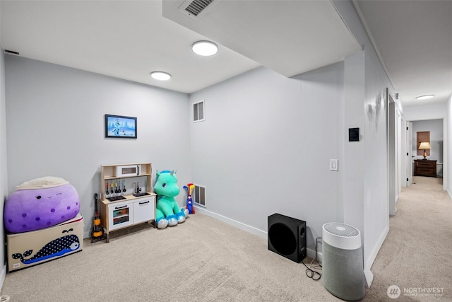 playroom with baseboards, carpet, and visible vents