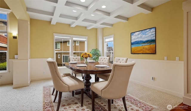dining room featuring recessed lighting, beamed ceiling, plenty of natural light, and coffered ceiling