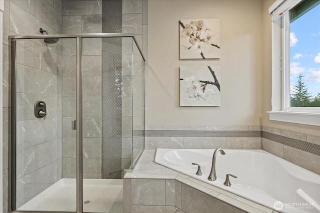 full bath with a shower stall and a bath