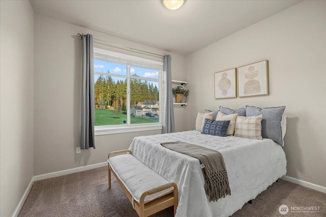 carpeted bedroom with baseboards