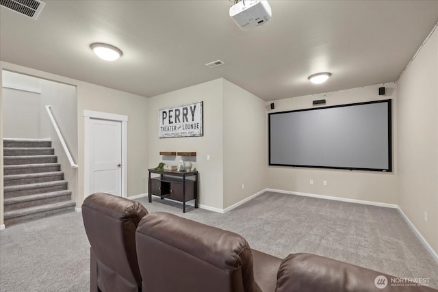 carpeted cinema room featuring baseboards and visible vents