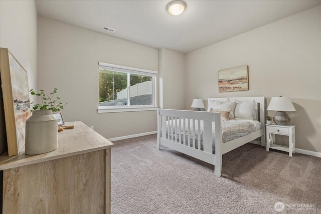 carpeted bedroom with baseboards and visible vents