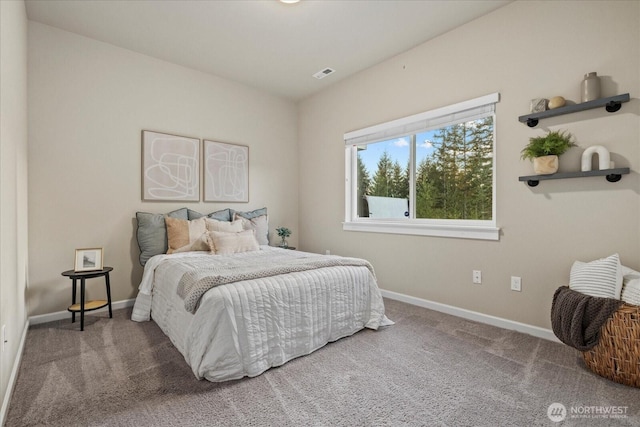 bedroom with carpet flooring, baseboards, and visible vents