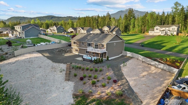 bird's eye view featuring a wooded view, a mountain view, and a residential view