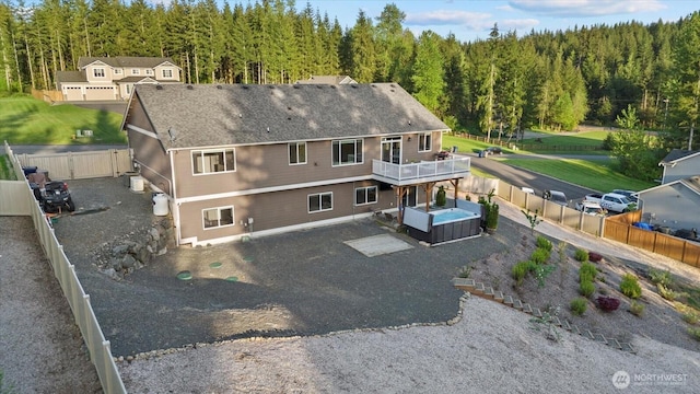 birds eye view of property featuring a view of trees