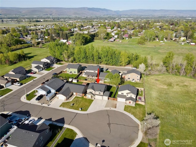 bird's eye view featuring a residential view and a mountain view