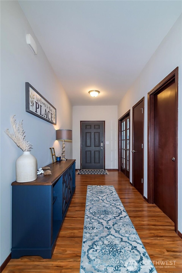 entrance foyer featuring french doors and wood finished floors
