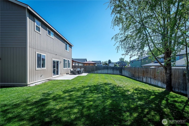 view of yard featuring a patio and a fenced backyard