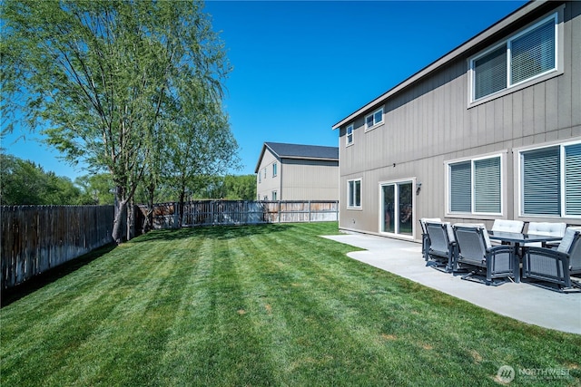 view of yard with a fenced backyard and a patio