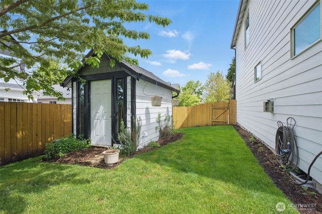 view of shed with a gate and a fenced backyard