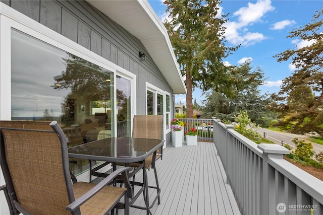 deck featuring outdoor dining area