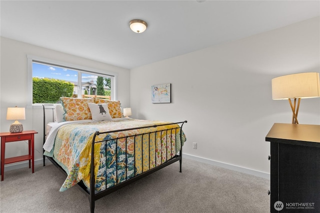 carpeted bedroom with baseboards