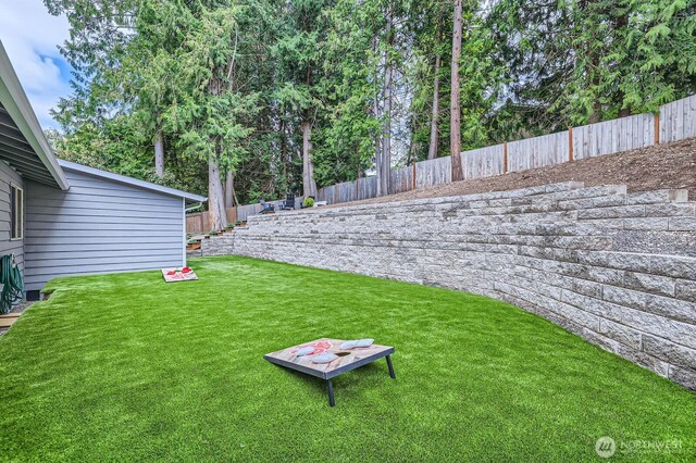 view of yard with a fenced backyard