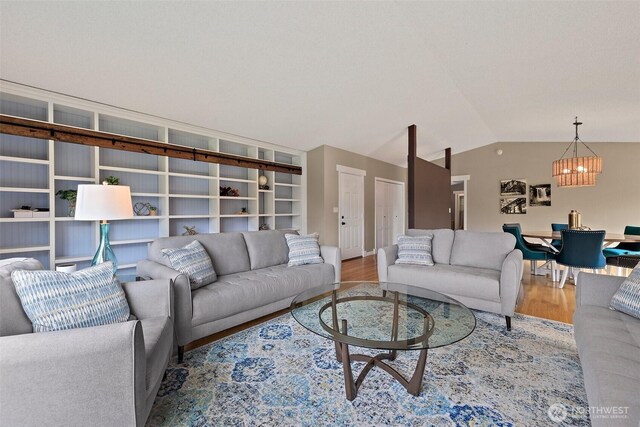 15304 SE 296th St, Kent, WA 98042 - living area featuring wood finished floors, a chandelier, and vaulted ceiling
