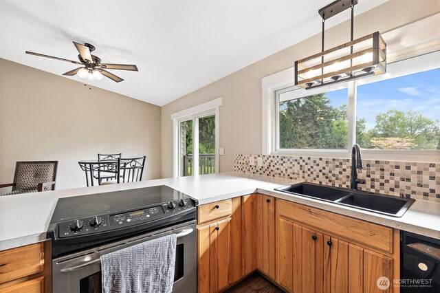 15304 SE 296th St, Kent, WA 98042 - kitchen featuring a sink, stainless steel range with electric stovetop, light countertops, a ceiling fan, and tasteful backsplash