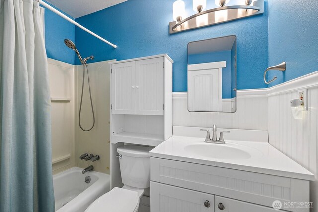 15304 SE 296th St, Kent, WA 98042 - bathroom with wainscoting, shower / tub combo, vanity, toilet, and a textured wall