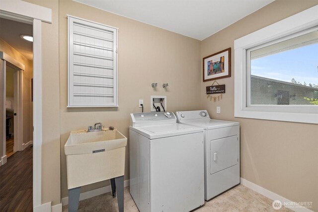 15304 SE 296th St, Kent, WA 98042 - washroom featuring laundry area, a sink, baseboards, and washing machine and dryer
