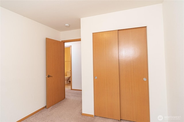 121 George Leslie Dr, Port Ludlow, WA 98365 - unfurnished bedroom featuring light carpet, a closet, and baseboards