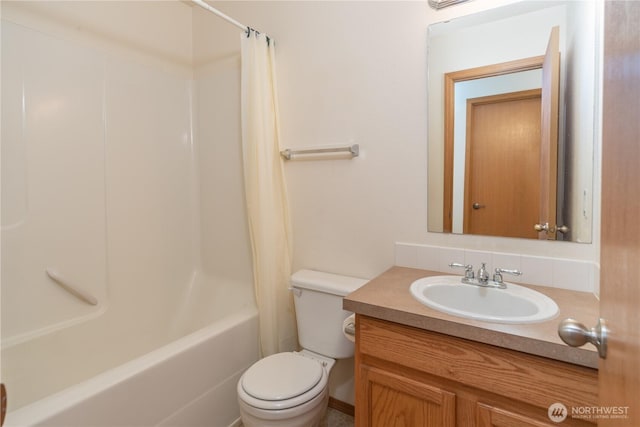 121 George Leslie Dr, Port Ludlow, WA 98365 - full bathroom featuring vanity, toilet, shower / bath combo with shower curtain, and tasteful backsplash