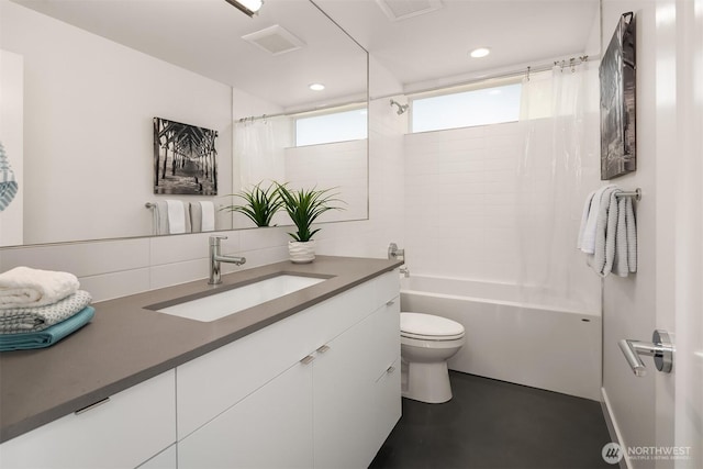 7356 21st Ave NW, Seattle, WA 98117 - full bath with decorative backsplash, shower / bath combo, vanity, toilet, and recessed lighting