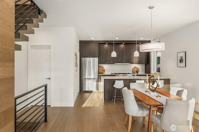 7356 21st Ave NW, Seattle, WA 98117 - dining area with baseboards, recessed lighting, and dark wood-style flooring