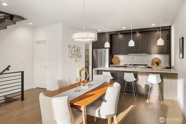 7356 21st Ave NW, Seattle, WA 98117 - dining space with light wood-type flooring, recessed lighting, and baseboards