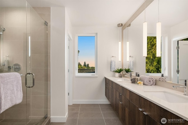 7356 21st Ave NW, Seattle, WA 98117 - full bathroom with baseboards, a sink, tile patterned floors, and a healthy amount of sunlight