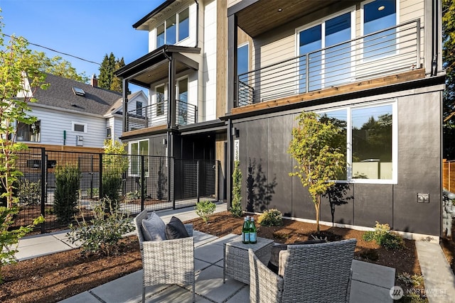7356 21st Ave NW, Seattle, WA 98117 - view of patio / terrace featuring fence and a balcony