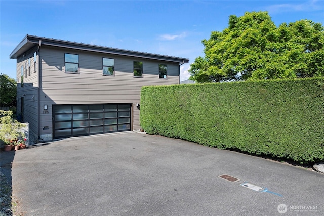 exterior space with a garage and driveway