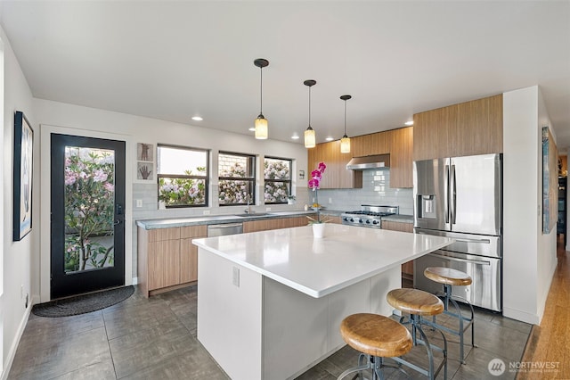 kitchen featuring stainless steel fridge with ice dispenser, decorative backsplash, stove, and extractor fan