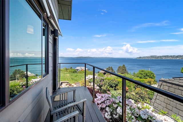 balcony featuring a water view