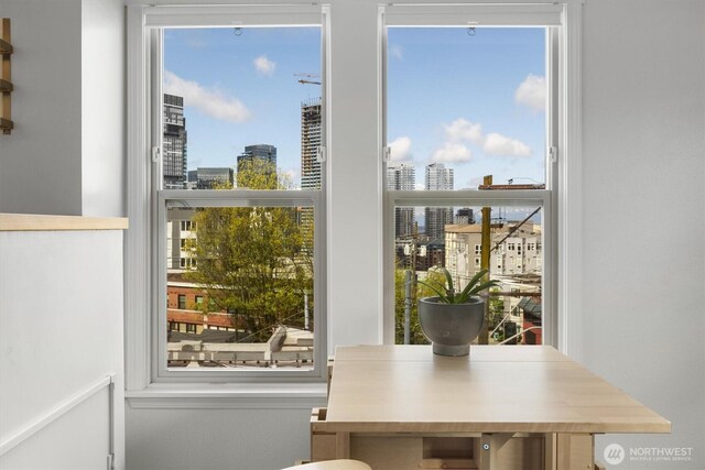 doorway with a view of skyline and healthy amount of natural light
