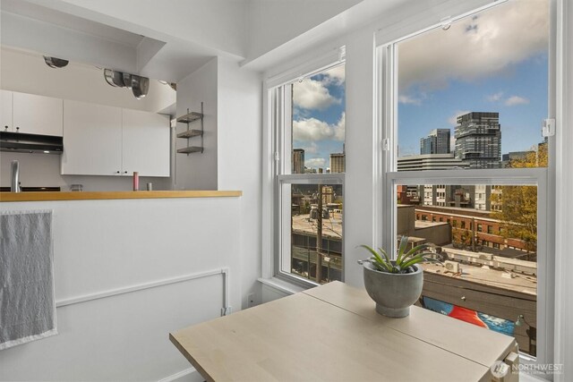 dining room featuring a view of city