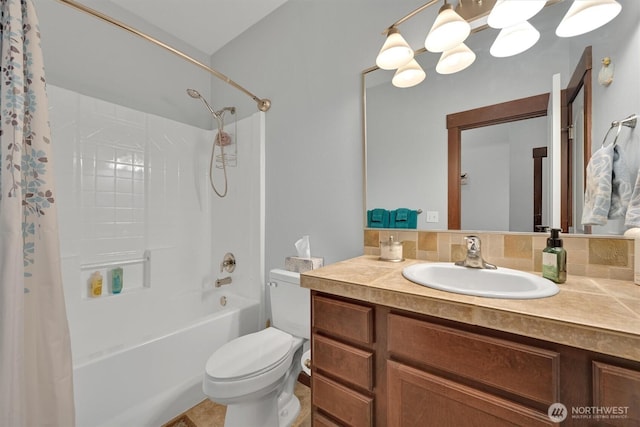 bathroom featuring toilet, shower / tub combo, and vanity