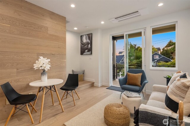 sitting room with recessed lighting, baseboards, light wood finished floors, and visible vents