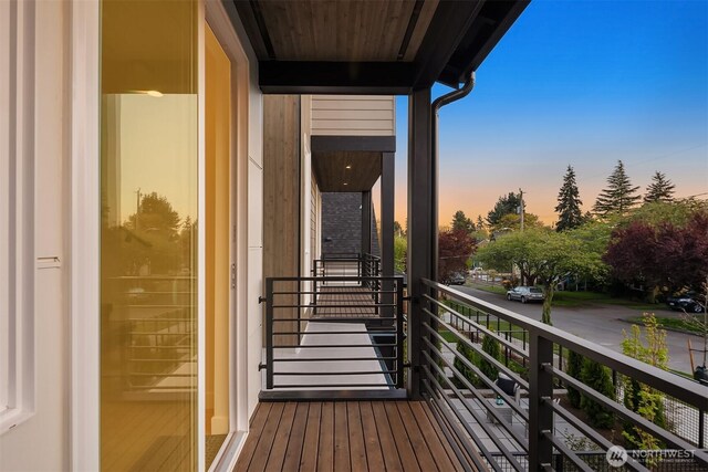 view of balcony at dusk