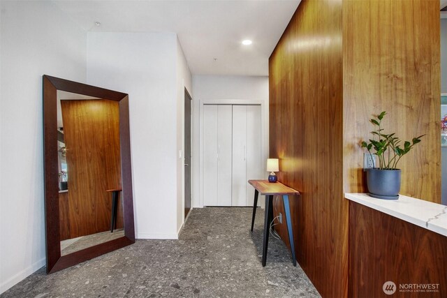 hallway featuring baseboards