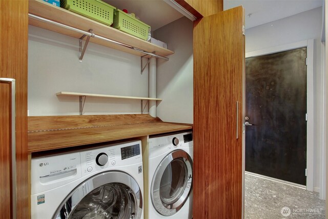 washroom with washer and dryer and laundry area