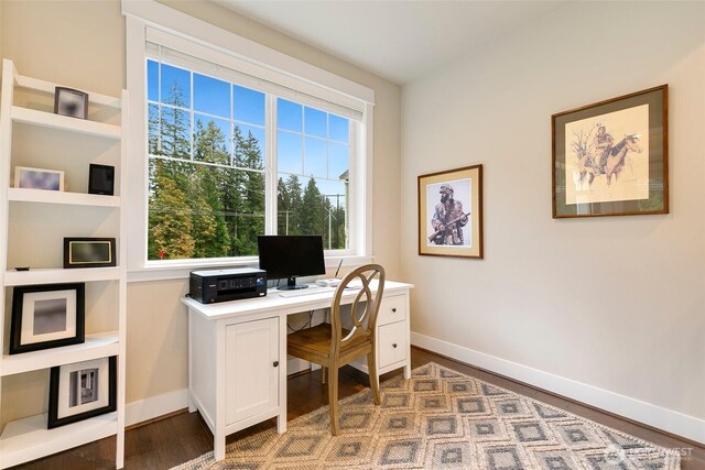 office space featuring baseboards and wood finished floors