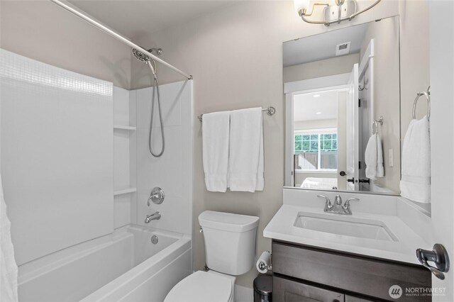bathroom featuring vanity, shower / tub combination, visible vents, and toilet
