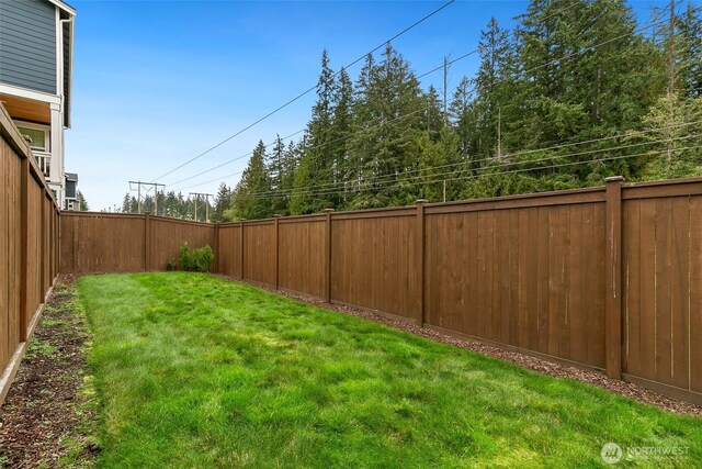 view of yard featuring a fenced backyard
