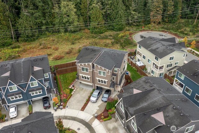 drone / aerial view featuring a view of trees