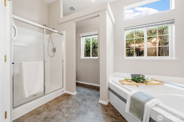 bathroom featuring baseboards, visible vents, a garden tub, and a stall shower