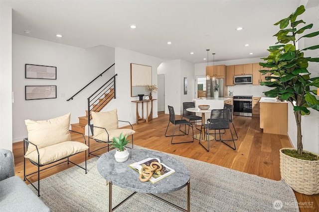 8018 24th Ave NW, Seattle, WA 98117 - living room with stairs, light wood finished floors, and recessed lighting